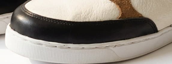 Stitched foxing where the cup sole meets the upper
