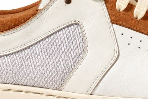 Open athletic mesh quarter backed with white calf